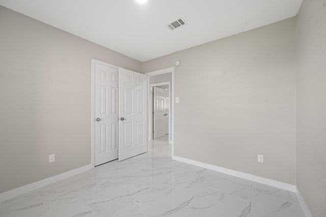 2414 Camillia St, Highlands, TX 77562 - unfurnished bedroom featuring baseboards and light marble finish floors