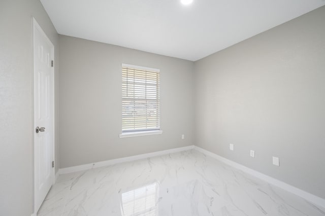 2414 Camillia St, Highlands, TX 77562 - spare room featuring light marble finish flooring and baseboards
