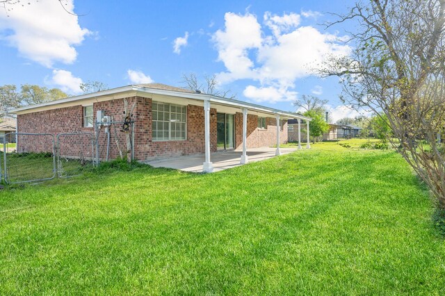 2414 Camillia St, Highlands, TX 77562 - back of property featuring a patio and brick siding