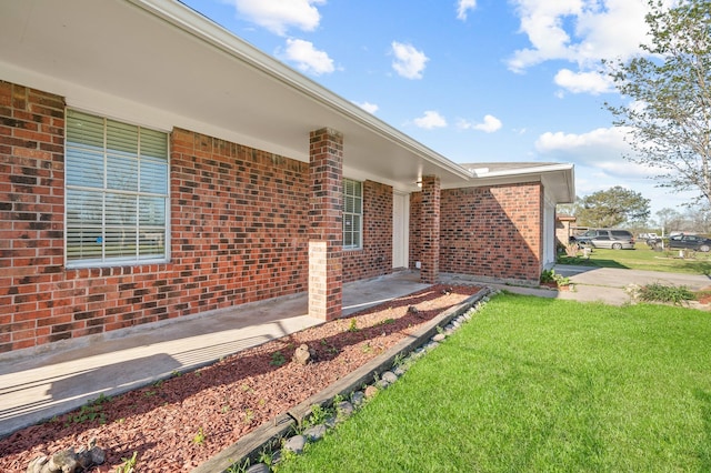 2414 Camillia St, Highlands, TX 77562 - property entrance featuring brick siding and a lawn