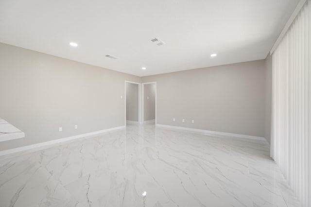2414 Camillia St, Highlands, TX 77562 - spare room featuring baseboards, light marble finish flooring, and recessed lighting