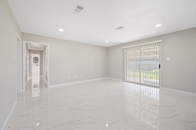 2414 Camillia St, Highlands, TX 77562 - empty room featuring light marble finish floors, baseboards, and recessed lighting