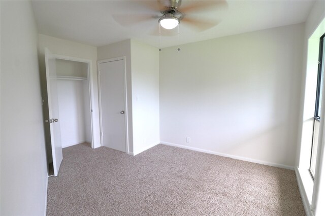 110 Bayou Dr, Baytown, TX 77520 - unfurnished bedroom with carpet flooring, baseboards, a ceiling fan, and a closet