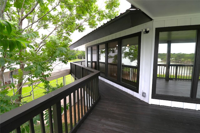 110 Bayou Dr, Baytown, TX 77520 - wooden terrace featuring a water view and a sunroom