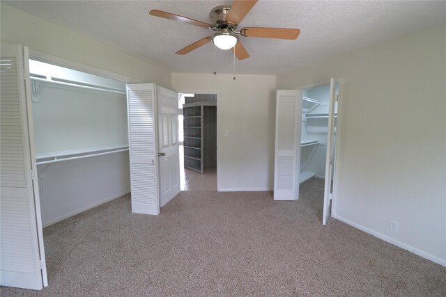 110 Bayou Dr, Baytown, TX 77520 - unfurnished bedroom featuring carpet flooring, a closet, baseboards, and ceiling fan