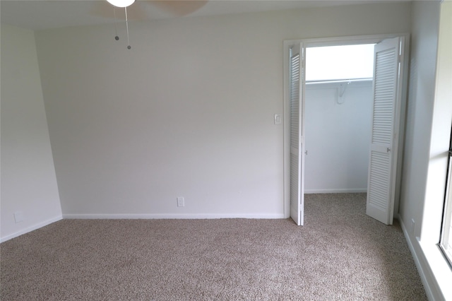 110 Bayou Dr, Baytown, TX 77520 - unfurnished bedroom with carpet, a closet, and baseboards