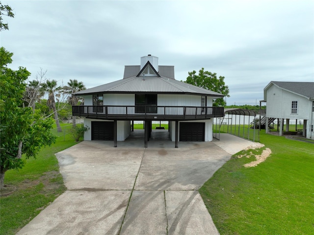 110 Bayou Dr, Baytown, TX 77520 - view of property's community featuring a yard, driveway, a garage, and stairway
