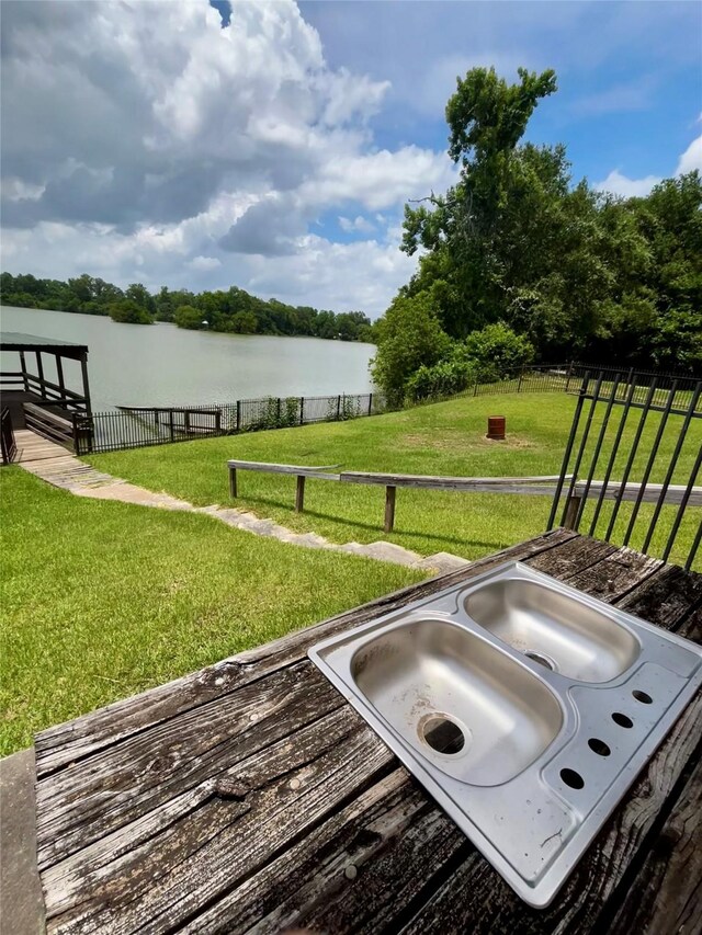125 Mimosa Pt, Livingston, TX 77351 - wooden terrace with a water view