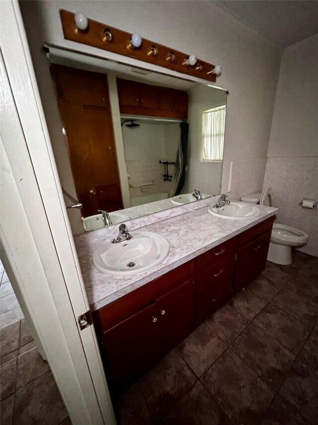 125 Mimosa Pt, Livingston, TX 77351 - bathroom with double vanity, toilet, tile patterned flooring, and a shower