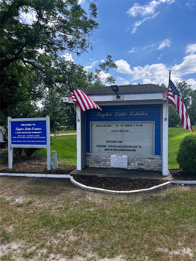 125 Mimosa Pt, Livingston, TX 77351 - community / neighborhood sign featuring a lawn