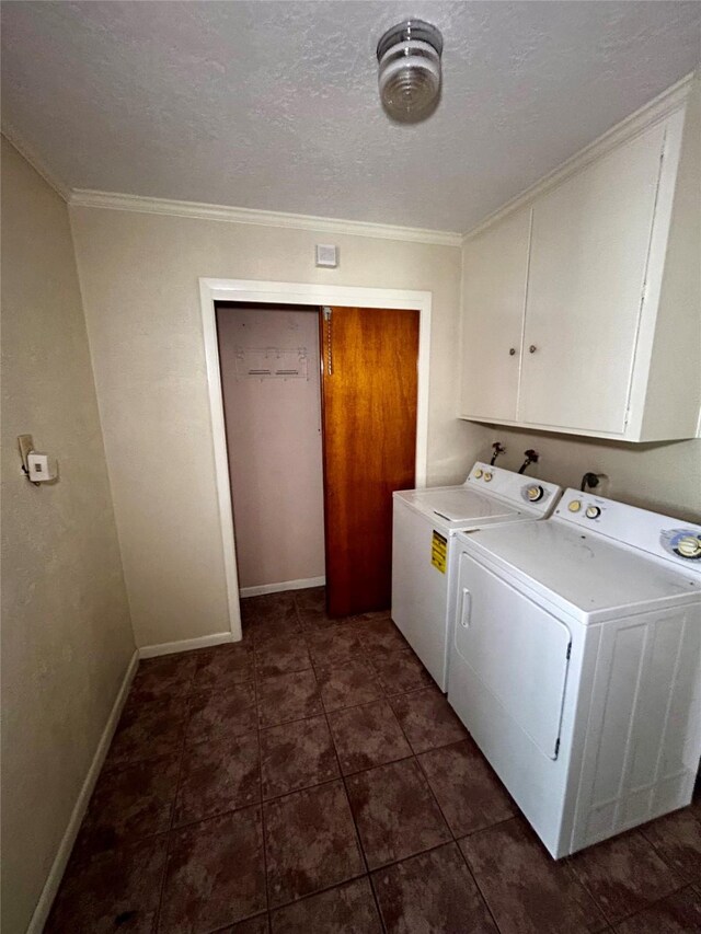 125 Mimosa Pt, Livingston, TX 77351 - laundry area with separate washer and dryer, cabinet space, ornamental molding, a textured ceiling, and baseboards