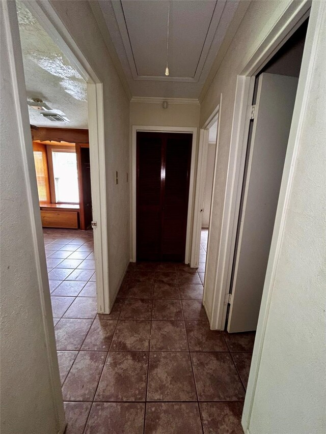 125 Mimosa Pt, Livingston, TX 77351 - hallway featuring attic access and tile patterned floors