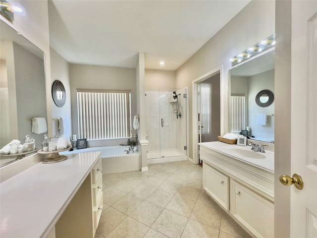 2807 Enchanted Landing Ct, Katy, TX 77494 - bathroom featuring a shower stall, vanity, a garden tub, and tile patterned flooring