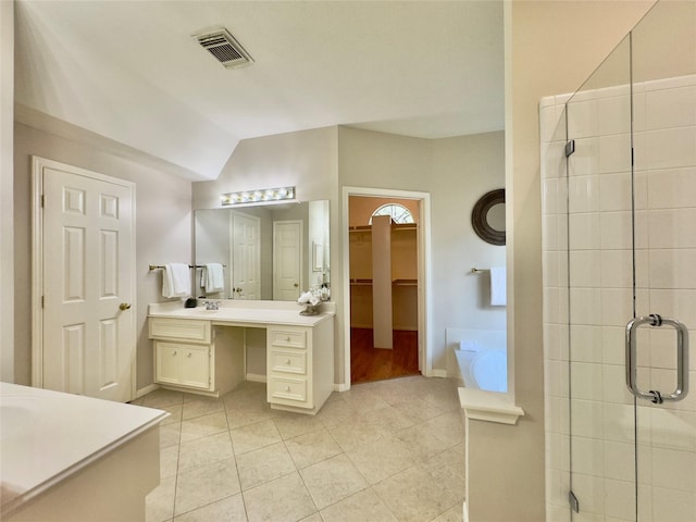 2807 Enchanted Landing Ct, Katy, TX 77494 - full bath featuring vanity, tile patterned floors, a shower stall, a spacious closet, and a garden tub
