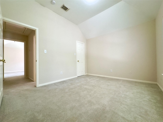 2807 Enchanted Landing Ct, Katy, TX 77494 - empty room featuring attic access, light carpet, vaulted ceiling, baseboards, and a smoke detector