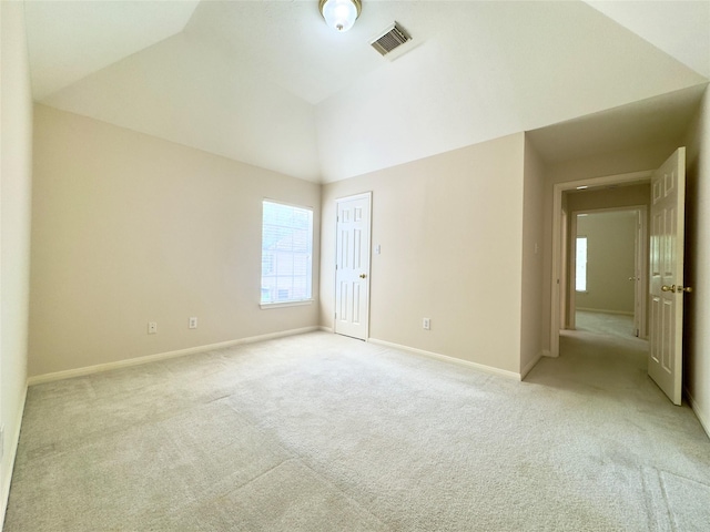 2807 Enchanted Landing Ct, Katy, TX 77494 - spare room with light colored carpet, healthy amount of natural light, vaulted ceiling, and baseboards