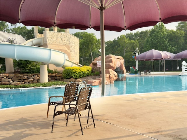 2807 Enchanted Landing Ct, Katy, TX 77494 - community pool with a water slide and a patio area