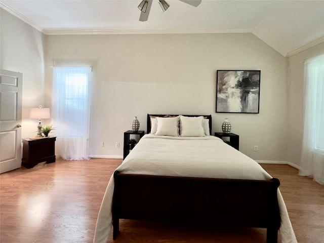 2807 Enchanted Landing Ct, Katy, TX 77494 - bedroom with wood finished floors, baseboards, crown molding, a ceiling fan, and lofted ceiling