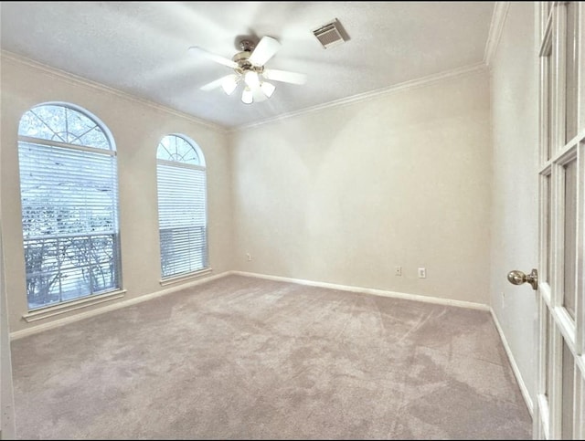 2807 Enchanted Landing Ct, Katy, TX 77494 - empty room featuring carpet, ceiling fan, ornamental molding, and baseboards