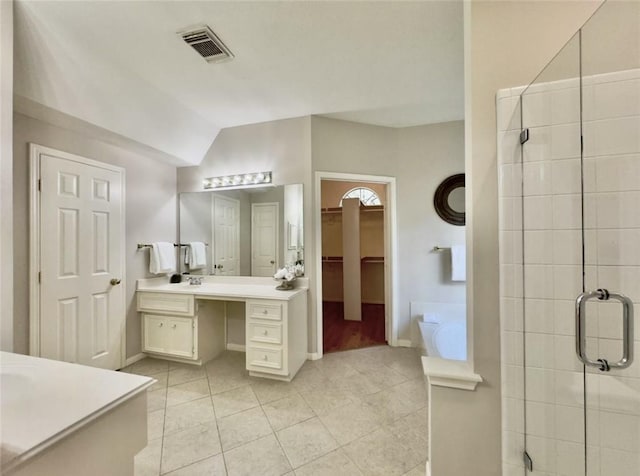 2807 Enchanted Landing Ct, Katy, TX 77494 - full bath with vanity, tile patterned flooring, a stall shower, a walk in closet, and vaulted ceiling