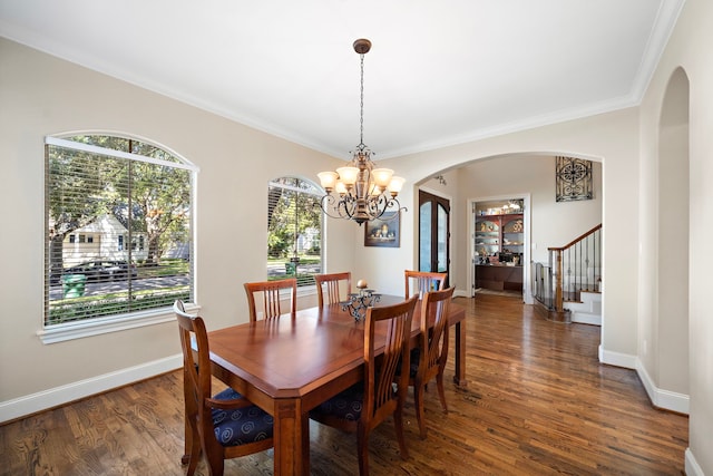 3327 Elmridge St, Houston, TX 77025 - dining area featuring a chandelier, arched walkways, healthy amount of natural light, stairway, and ornamental molding