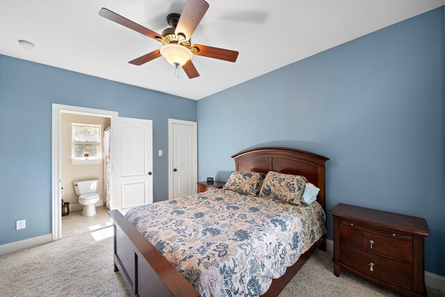 3327 Elmridge St, Houston, TX 77025 - carpeted bedroom with baseboards, a ceiling fan, and connected bathroom
