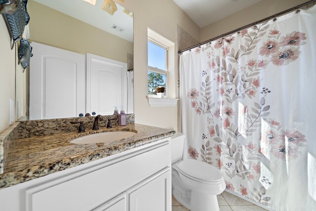 3327 Elmridge St, Houston, TX 77025 - bathroom with vanity, toilet, tile patterned floors, and a shower with shower curtain