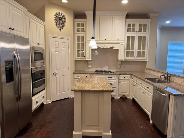 22115 Canyonwood Park Ln, Richmond, TX 77469 - kitchen featuring stainless steel appliances, a sink, recessed lighting, dark wood-style flooring, and white cabinetry