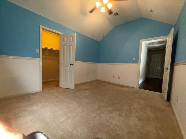 22115 Canyonwood Park Ln, Richmond, TX 77469 - unfurnished bedroom featuring lofted ceiling, carpet, a spacious closet, ceiling fan, and a closet