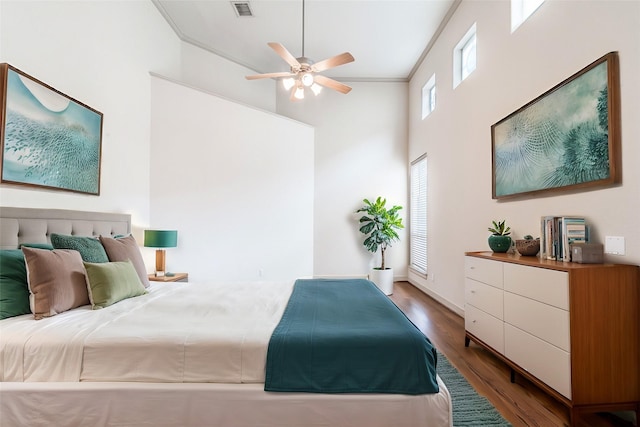 403 Harborside Way, Kemah, TX 77565 - bedroom with wood finished floors, a towering ceiling, ceiling fan, and baseboards