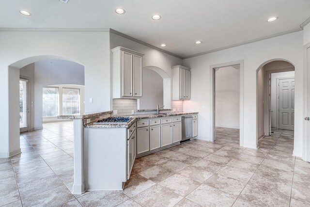 403 Harborside Way, Kemah, TX 77565 - kitchen with recessed lighting, appliances with stainless steel finishes, decorative backsplash, arched walkways, and baseboards