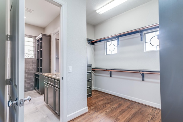 403 Harborside Way, Kemah, TX 77565 - spacious closet featuring light wood-style floors
