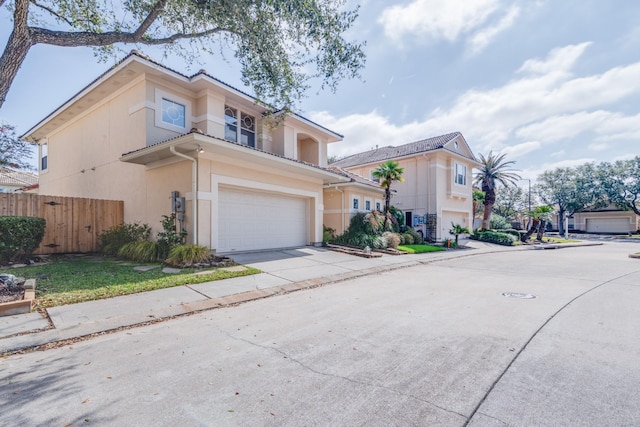 403 Harborside Way, Kemah, TX 77565 - view of front of house featuring an attached garage, concrete driveway, and stucco siding