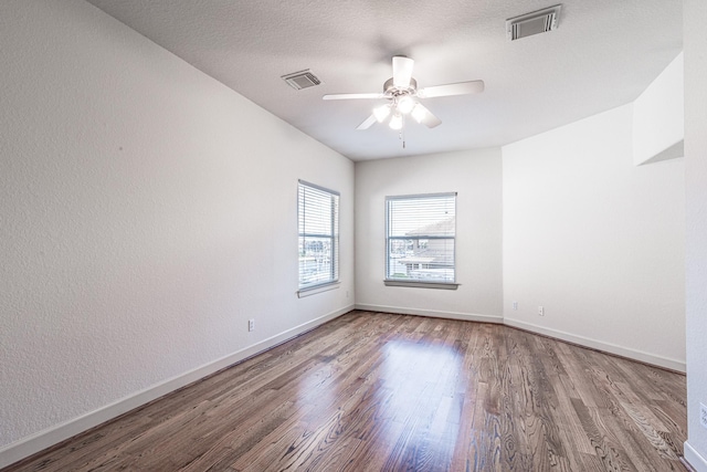 403 Harborside Way, Kemah, TX 77565 - unfurnished room with wood finished floors, ceiling fan, and baseboards