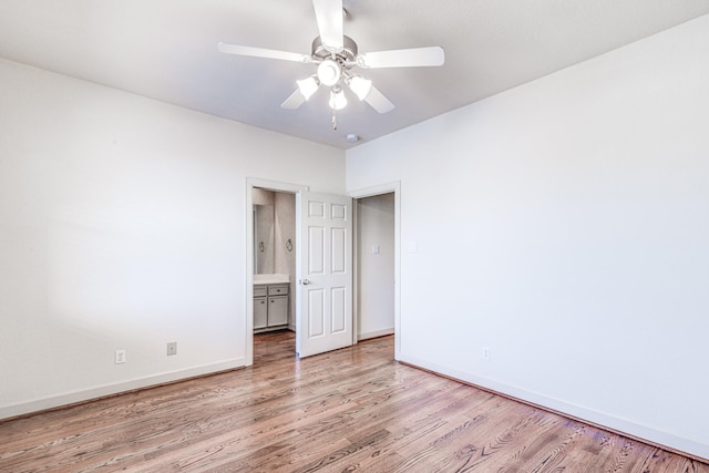 403 Harborside Way, Kemah, TX 77565 - unfurnished room with light wood finished floors, a ceiling fan, and baseboards