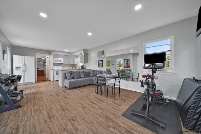 6803 Shady Ln, Richmond, TX 77406 - exercise room with light wood-type flooring, baseboards, and recessed lighting