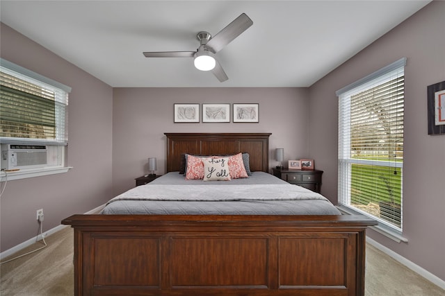 6803 Shady Ln, Richmond, TX 77406 - bedroom featuring light carpet, cooling unit, baseboards, and ceiling fan
