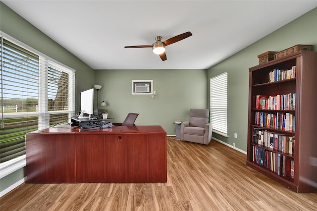 6803 Shady Ln, Richmond, TX 77406 - home office with a ceiling fan, wood finished floors, and baseboards