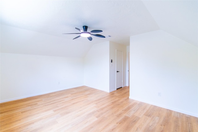 12419 Huntington Field Dr, Houston, TX 77099 - additional living space featuring vaulted ceiling, a ceiling fan, light wood finished floors, and baseboards