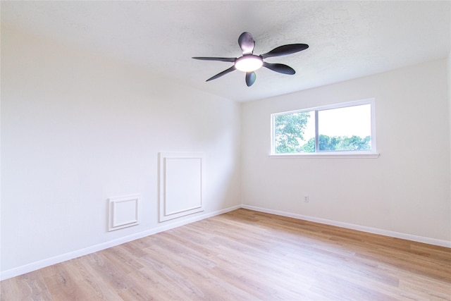 12419 Huntington Field Dr, Houston, TX 77099 - spare room featuring light wood-style flooring, baseboards, and ceiling fan