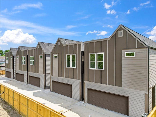3409 Stonewall St, Houston, TX 77020 - view of front of property featuring board and batten siding and an attached garage