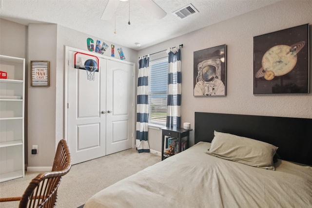 15603 Clearwater Bend Dr, Houston, TX 77044 - bedroom with carpet, baseboards, a closet, and a ceiling fan