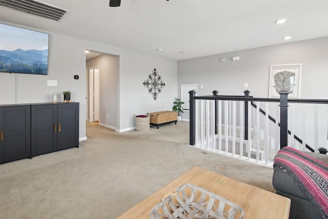 15603 Clearwater Bend Dr, Houston, TX 77044 - sitting room featuring light carpet, an upstairs landing, recessed lighting, and baseboards
