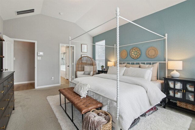 15603 Clearwater Bend Dr, Houston, TX 77044 - carpeted bedroom with vaulted ceiling, baseboards, and ensuite bath