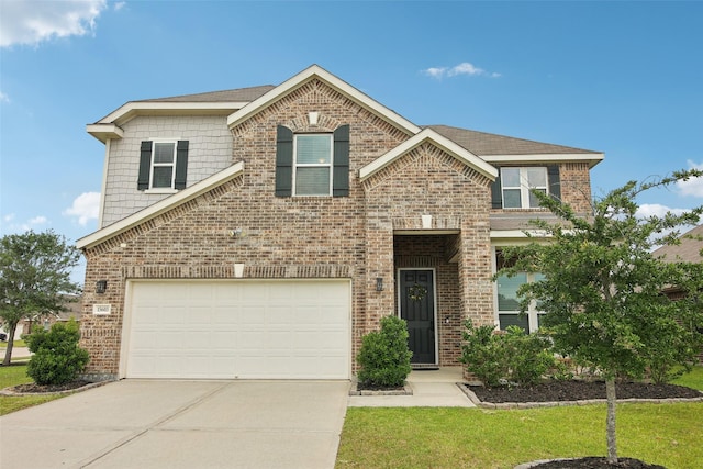 15603 Clearwater Bend Dr, Houston, TX 77044 - traditional-style home with brick siding, concrete driveway, and a garage