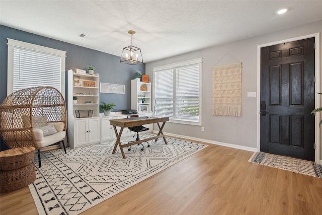 15603 Clearwater Bend Dr, Houston, TX 77044 - office with light wood-style flooring, baseboards, a chandelier, and recessed lighting
