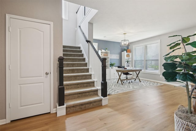 15603 Clearwater Bend Dr, Houston, TX 77044 - stairway with wood finished floors and baseboards