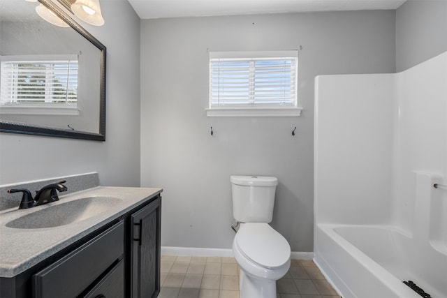 17520 E Williams Rd, Conroe, TX 77303 - bathroom featuring toilet, vanity, tile patterned floors, baseboards, and shower / bathtub combination