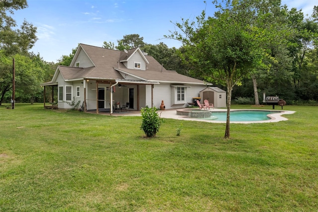 17520 E Williams Rd, Conroe, TX 77303 - rear view of property with a patio, a pool with connected hot tub, and a yard