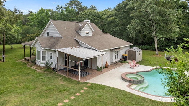 17520 E Williams Rd, Conroe, TX 77303 - rear view of property featuring a patio, a shingled roof, a lawn, a chimney, and a pool with connected hot tub
